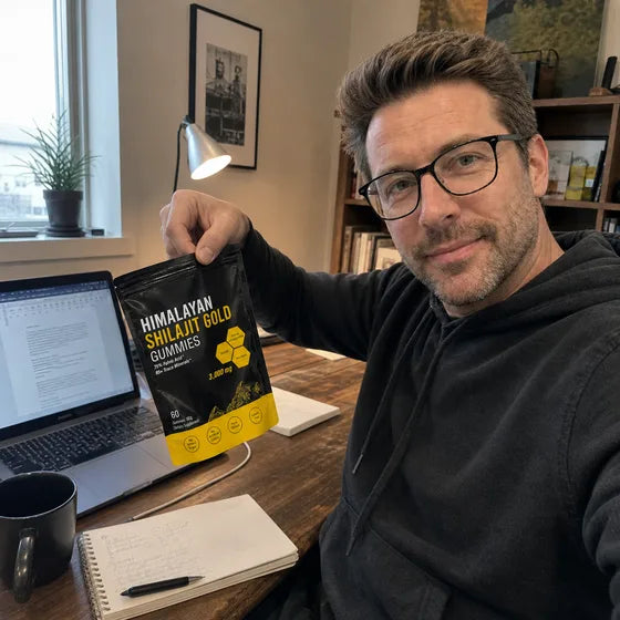 Customer holding MENRYX Himalayan Shilajit Gold Gummies in a home office