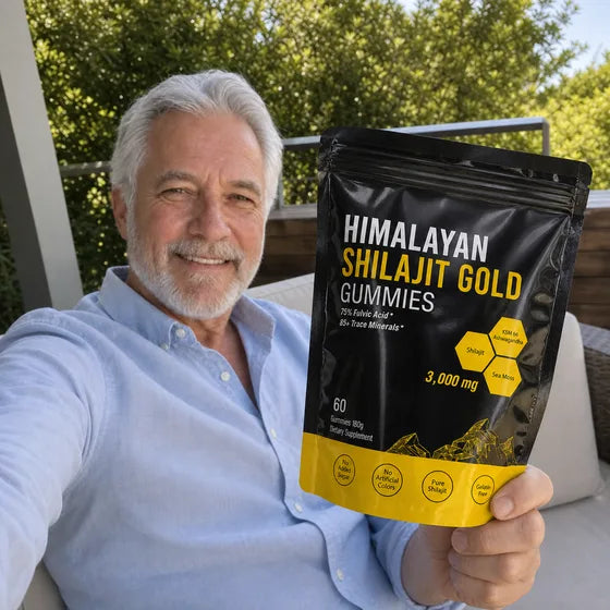 Senior customer holding MENRYX Himalayan Shilajit Gold Gummies on a patio